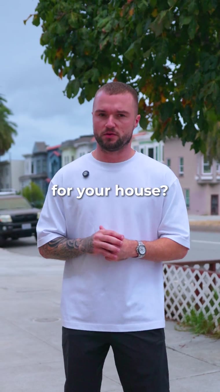 Mark of Adler Builders talking in front of a 1906 house