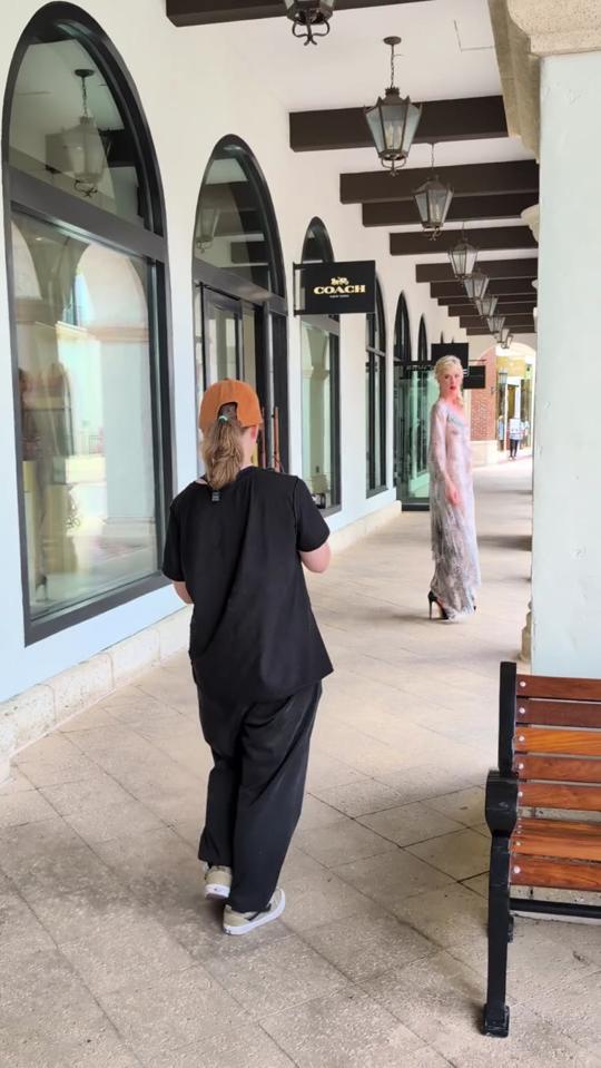Alisa filming a model under the arches
