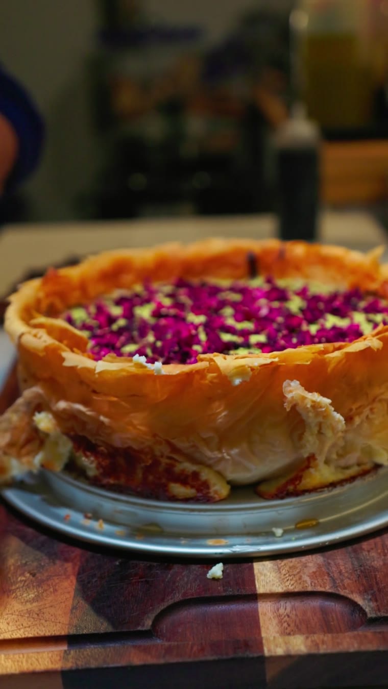 Cheminé, a pistachio and rose-petal cheesecake being cut